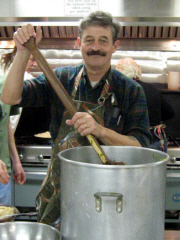 Ted Pack stirring 30 pounds of string beans for the homeless dinner